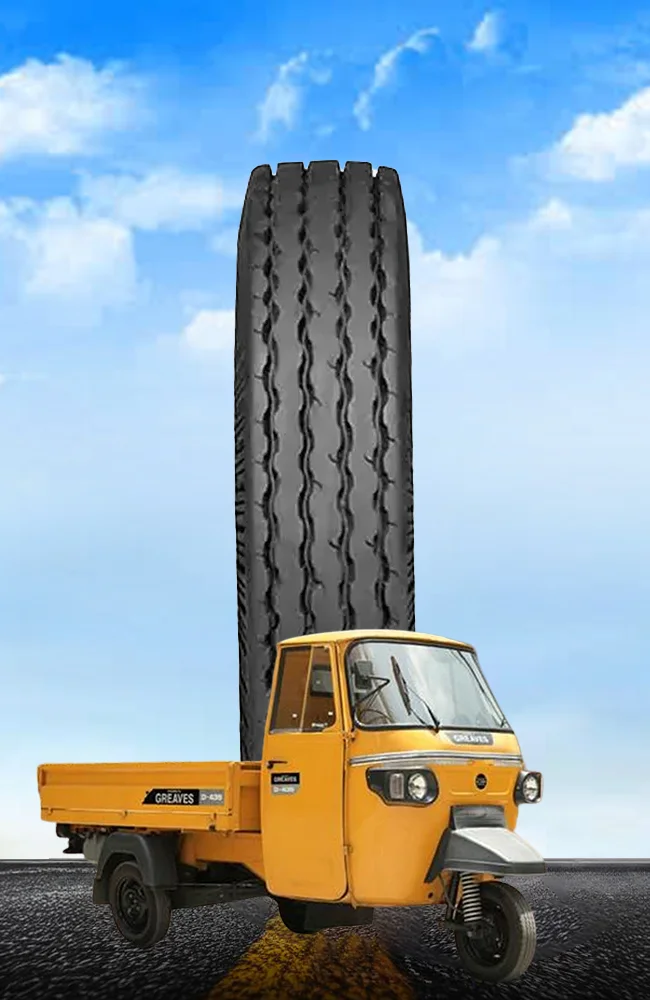 Yellow cargo three wheeler with heavy-duty commercial tyre designed for load carrying, stability, durability, road grip, and reliable transportation performance.